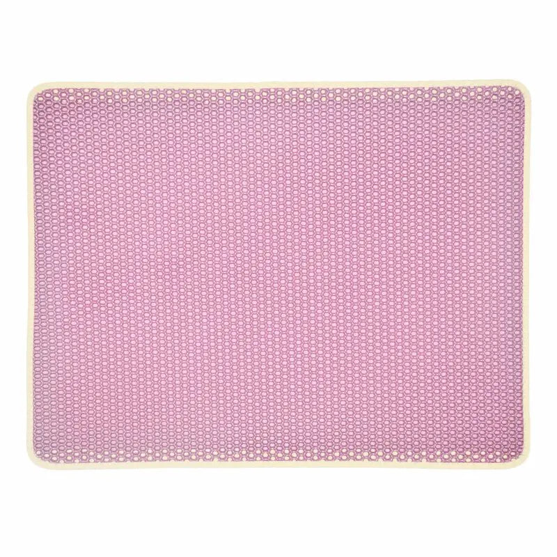 Cat litter tracking mat placed around a litter box